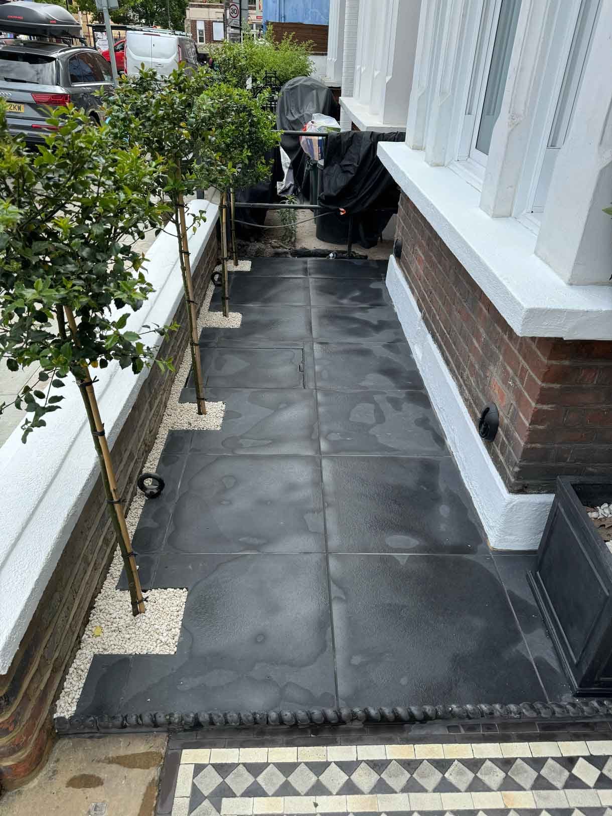 Front garden in Battersea with black porcelain tiles