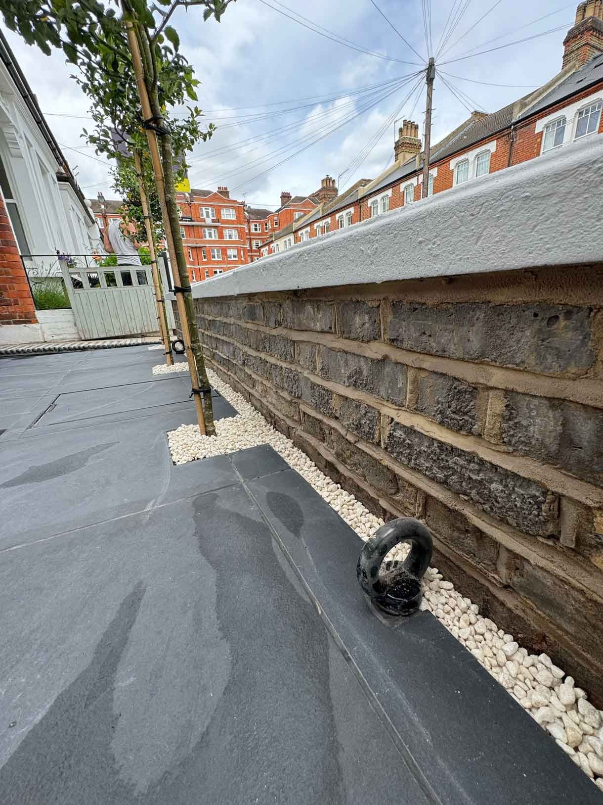 Front garden in Battersea with black porcelain tiles