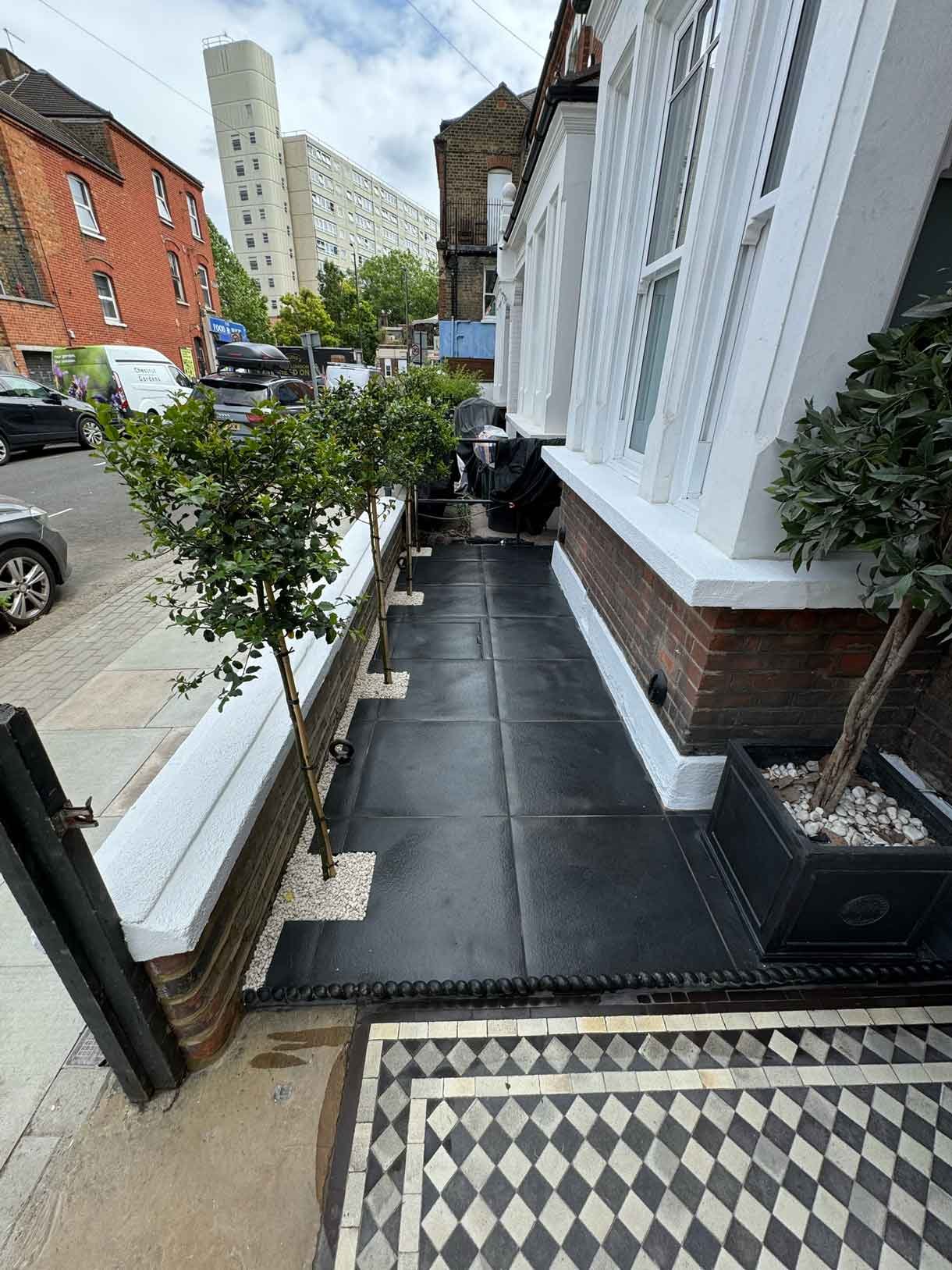 Front garden in Battersea with black porcelain tiles