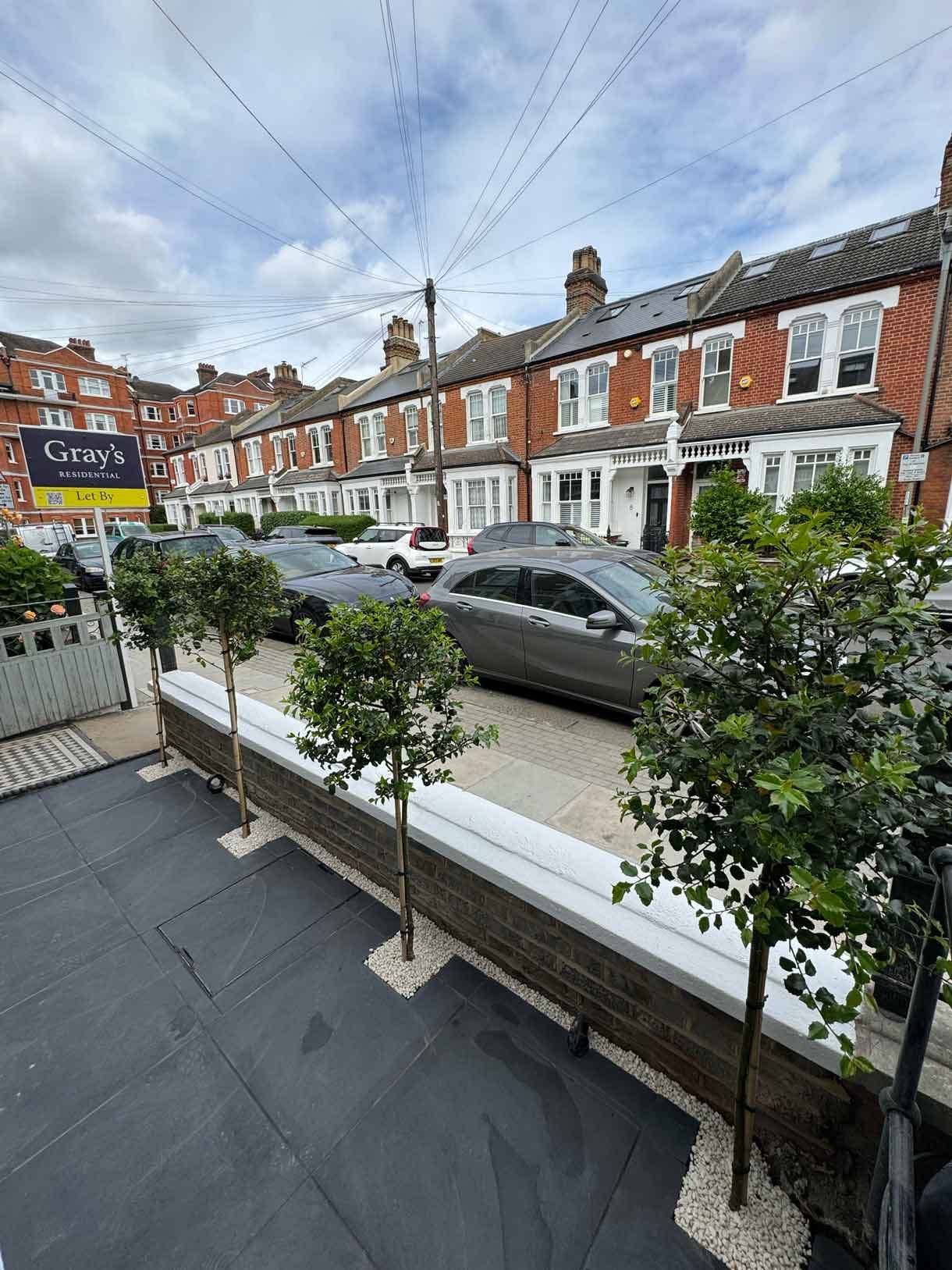 Front garden in Battersea with black porcelain tiles