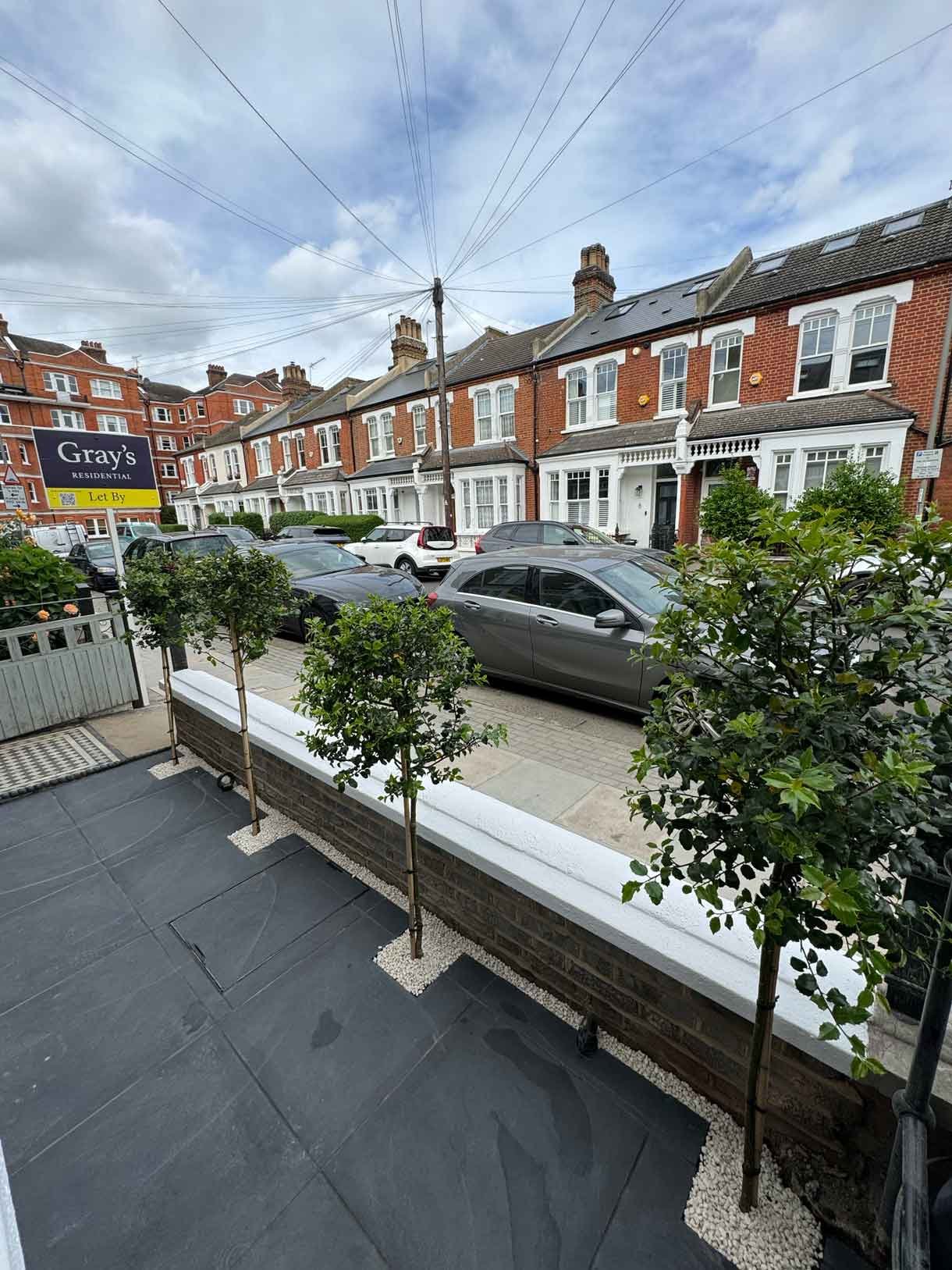 Front garden in Battersea with black porcelain tiles