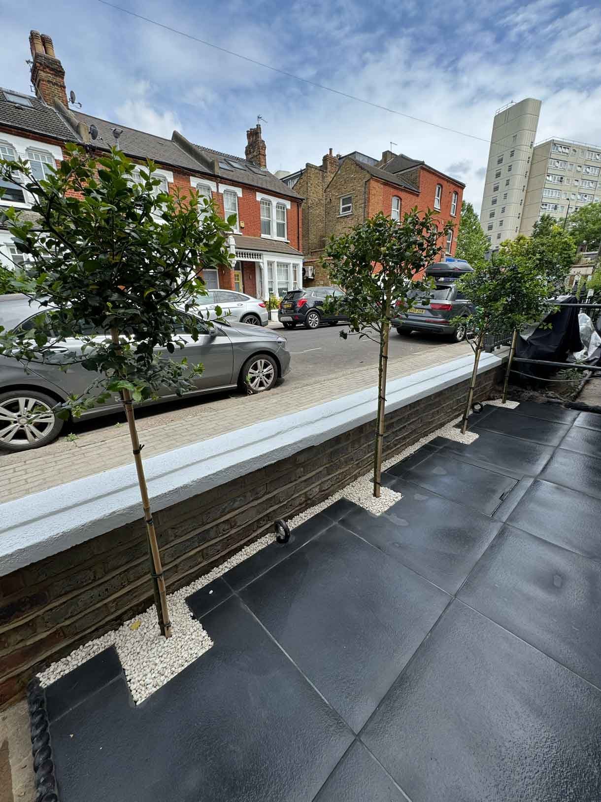 Front garden in Battersea with black porcelain tiles