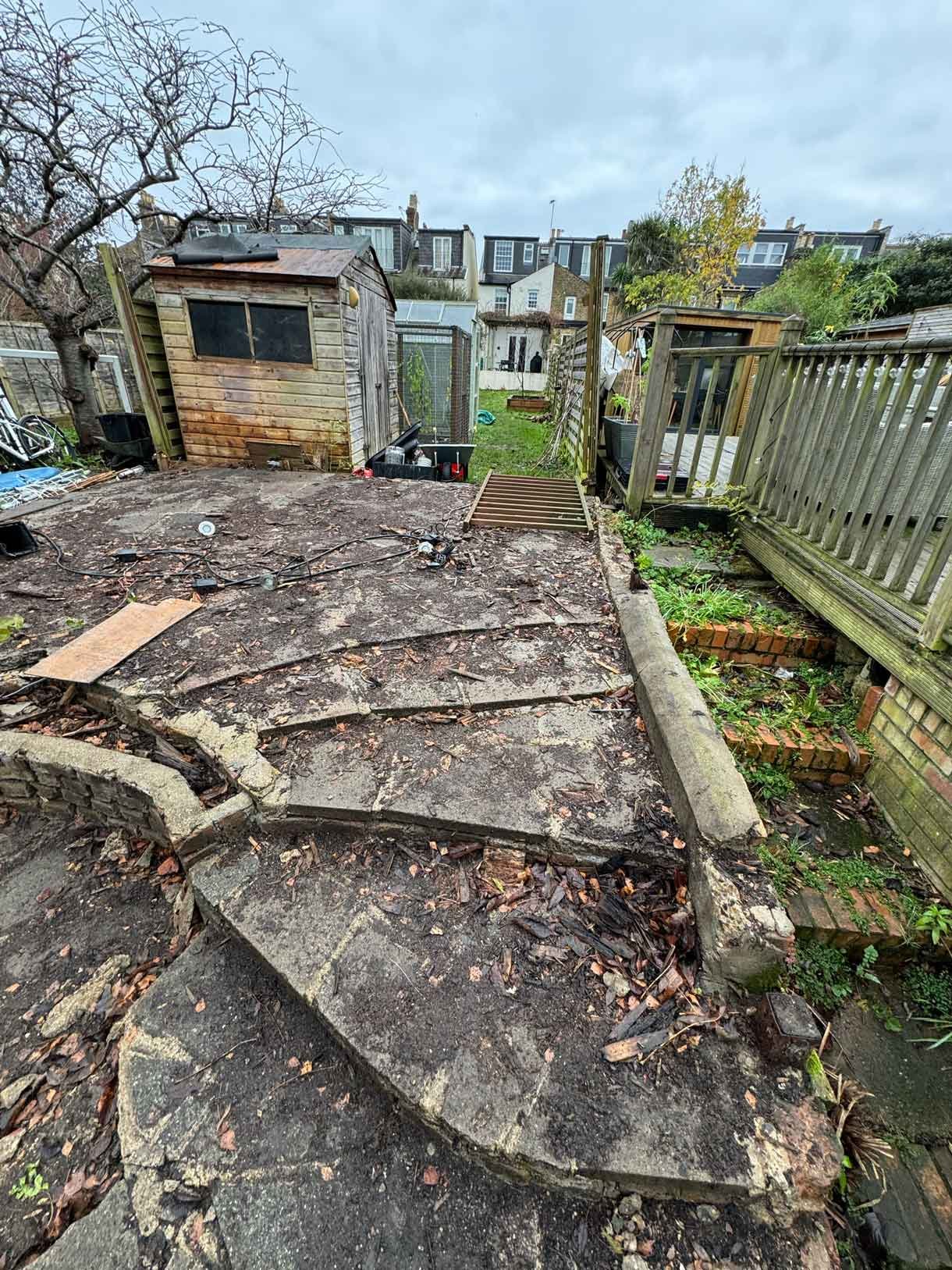 An old broke concrete patio before the build
