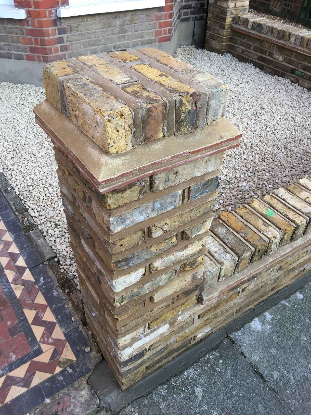 The brick wall being constructed
