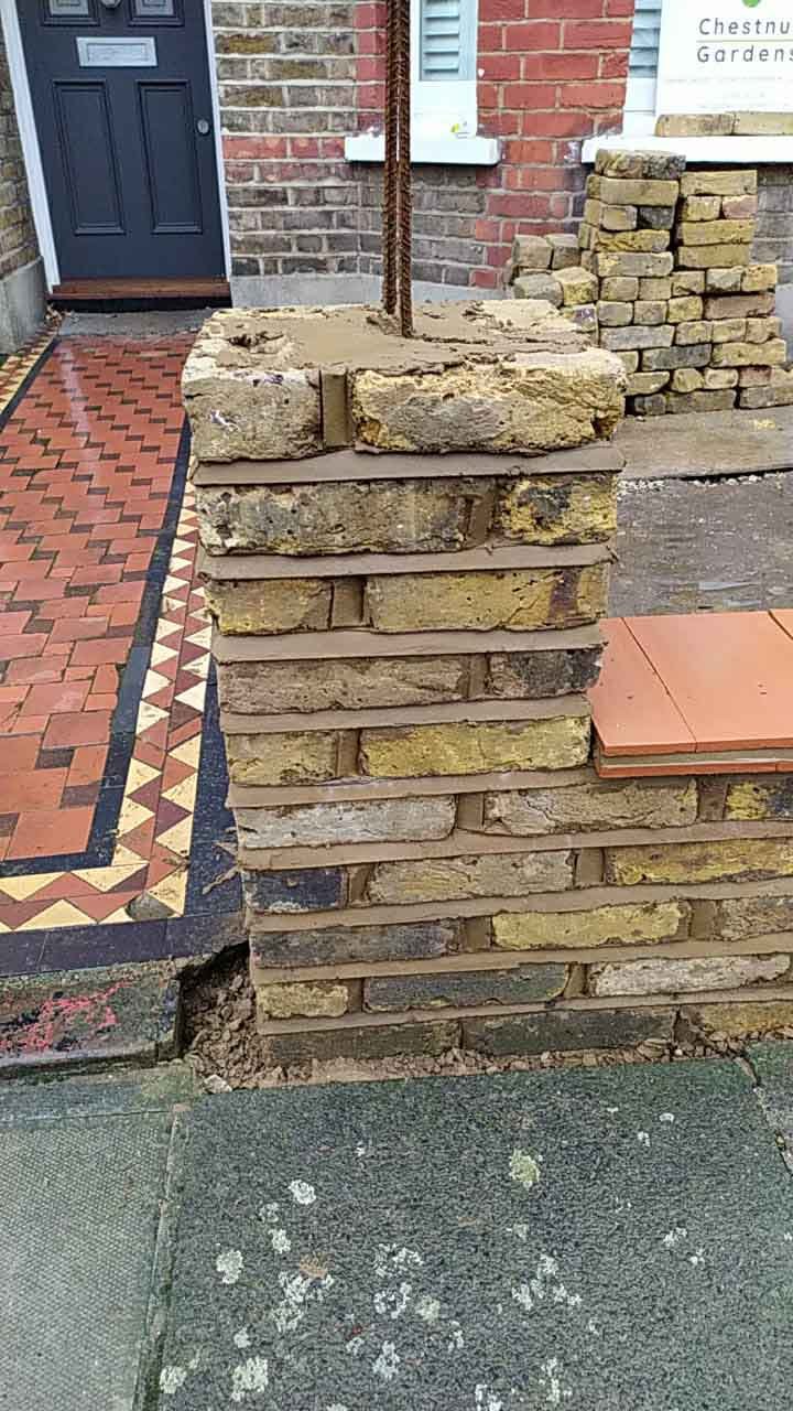 The brick wall being constructed