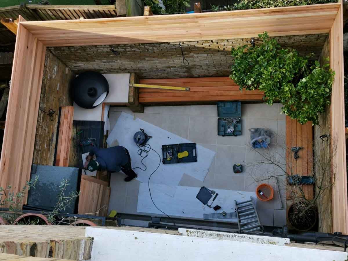 A small courtyard garden in Chiswick, using cedar battens for the fencing and porcelain tiles for the patio area.