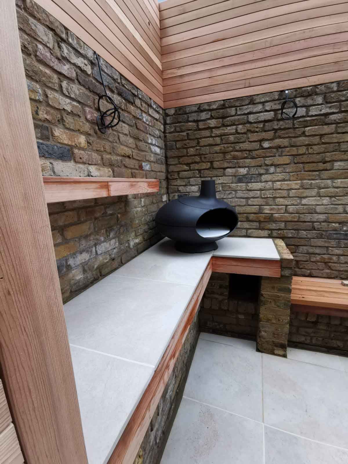 A small courtyard garden in Chiswick, using cedar battens for the fencing and porcelain tiles for the patio area.