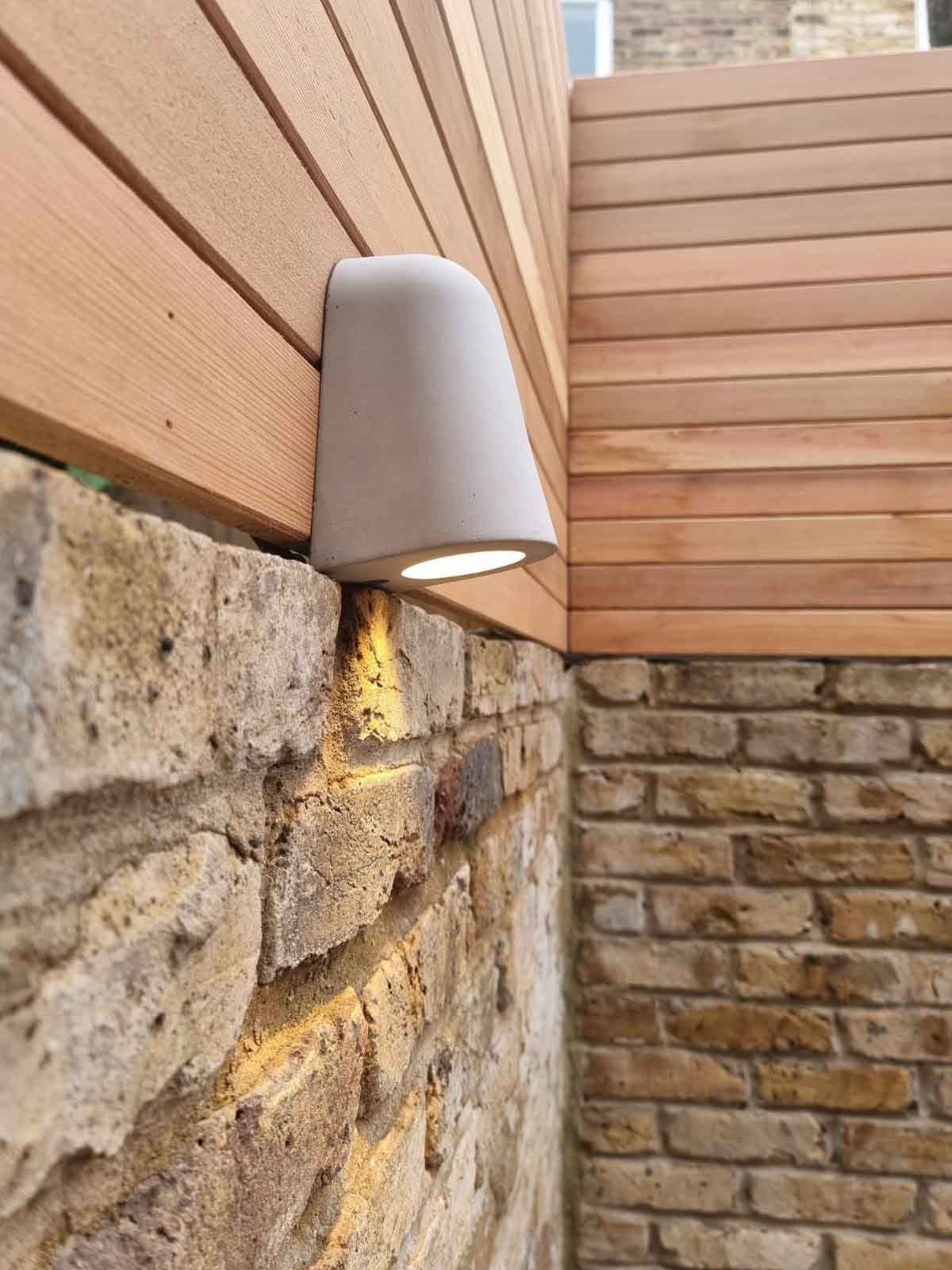 A light fixing on the wall of the courtyard garden.