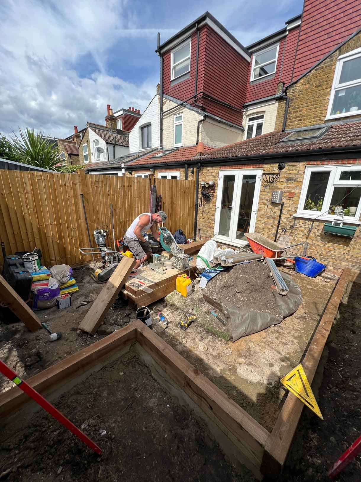 Construction images of a landscaping project of a circular bench.