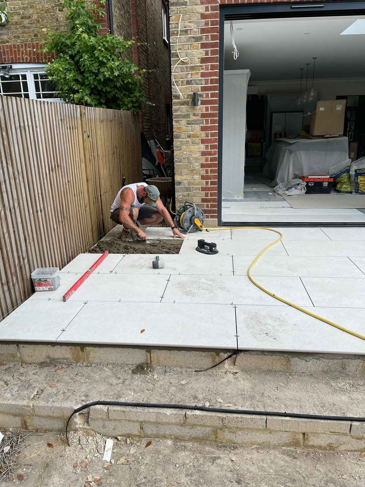 Construction images of a landscaping project of a circular bench.