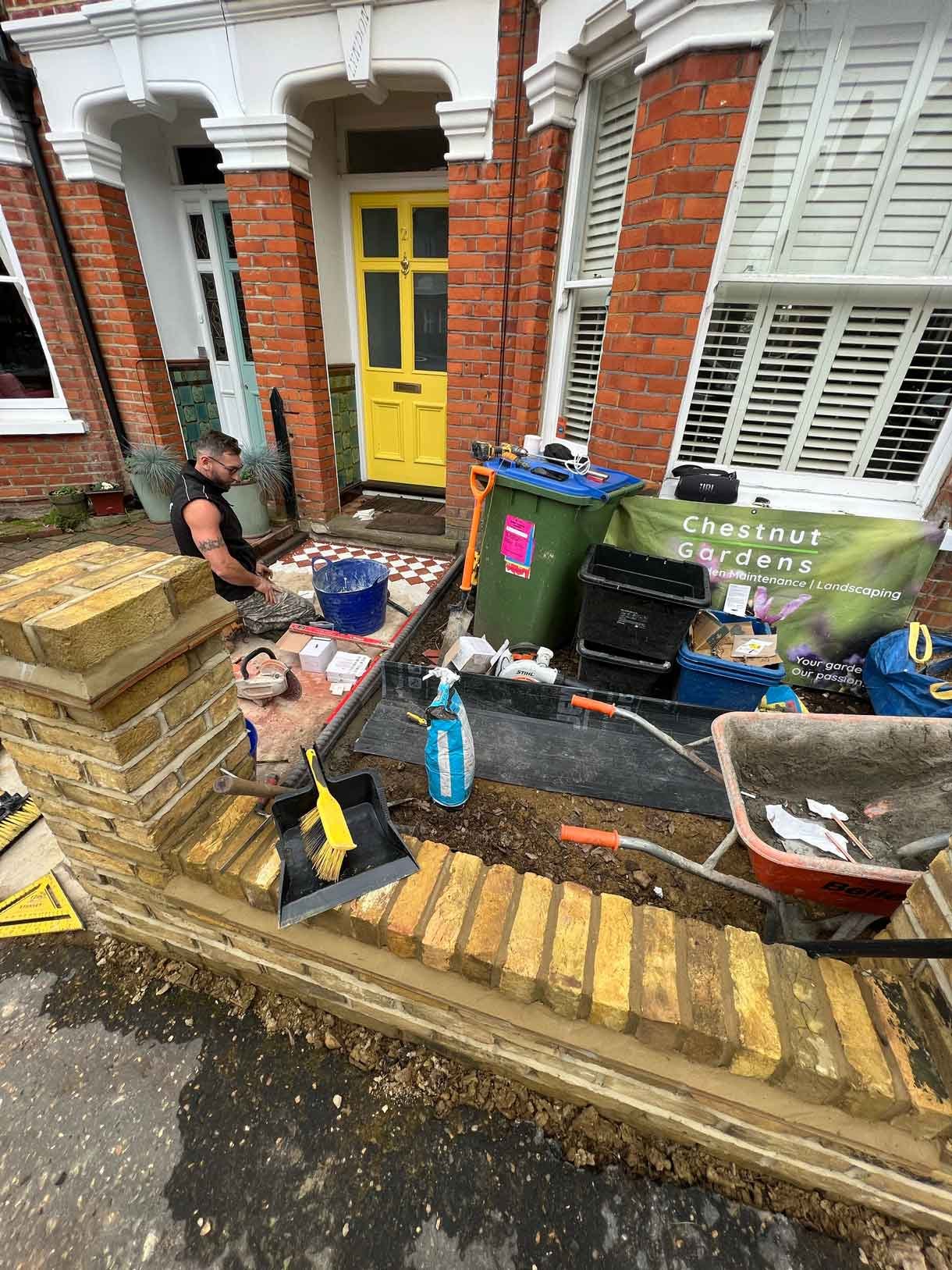 Construction images of a landscaping project of a circular bench.