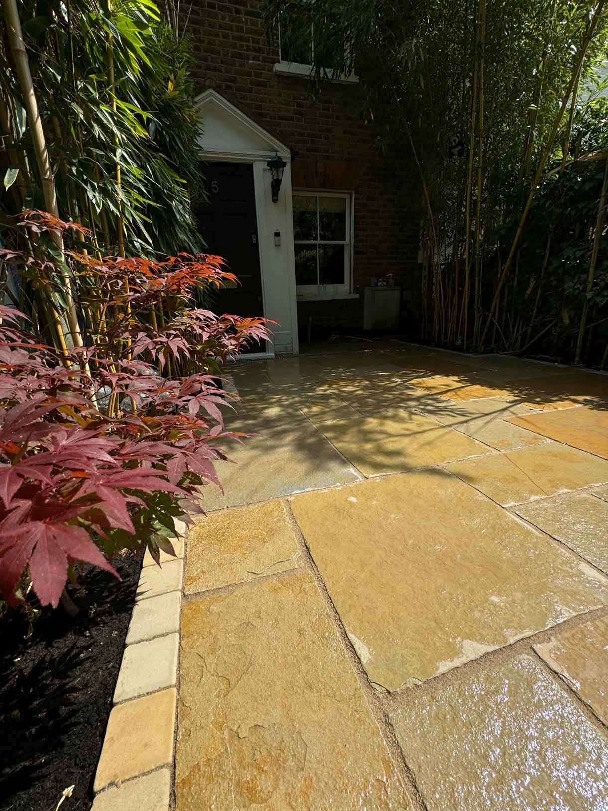 A new limestone patio in the project pack pattern. Beige and warm yellow colours.
