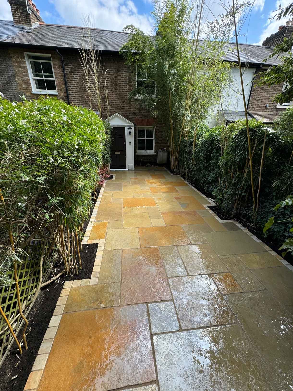 A new limestone patio in the project pack pattern. Beige and warm yellow colours.