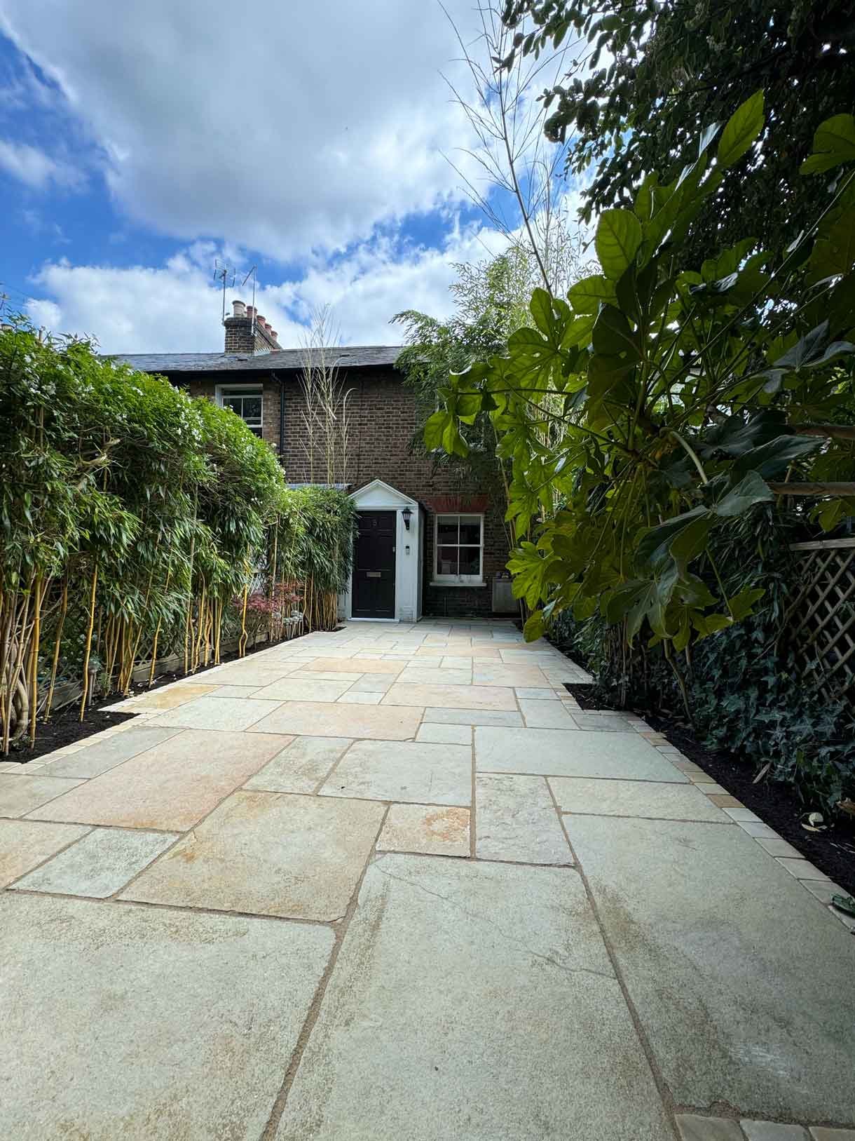 A new limestone patio in the project pack pattern. Beige and warm yellow colours.