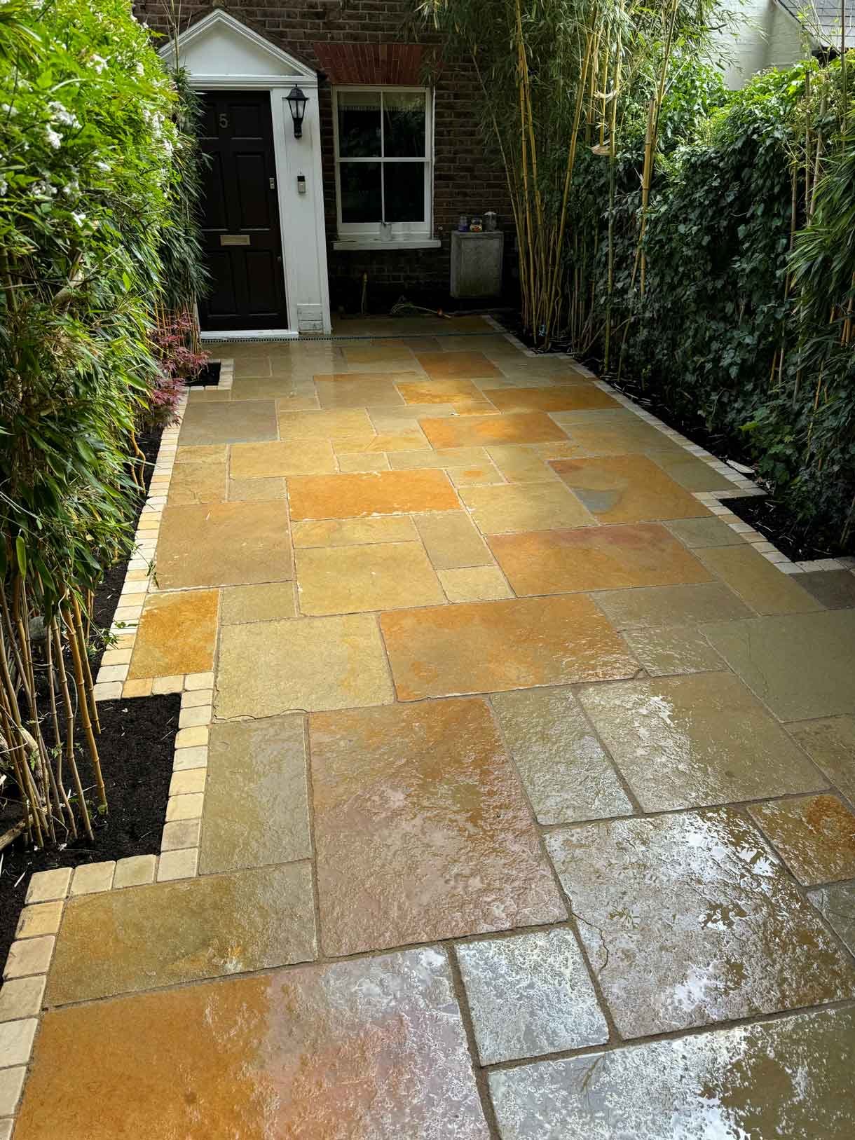 A new limestone patio in the project pack pattern. Beige and warm yellow colours.