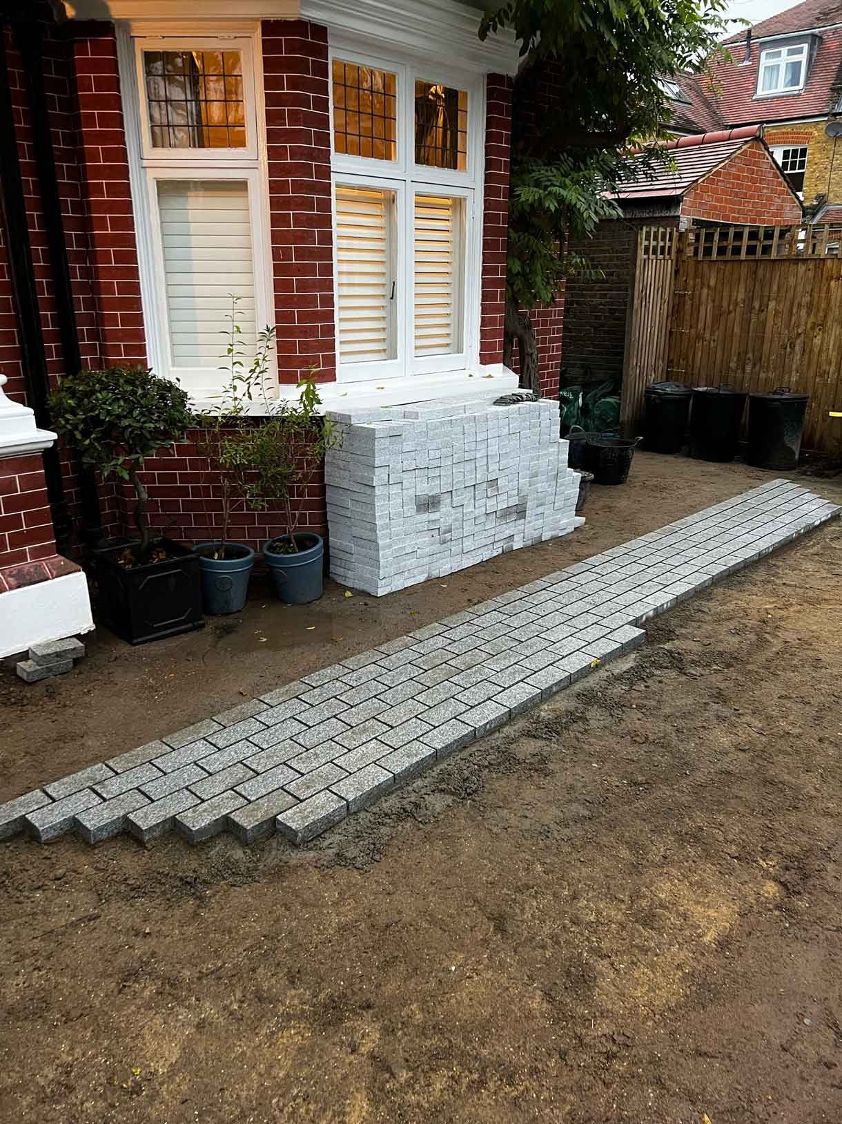 A driveway made from granite setts for this redbrick property in Putney.