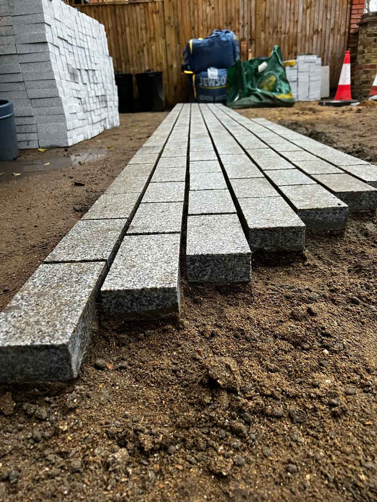 A driveway made from granite setts for this redbrick property in Putney.