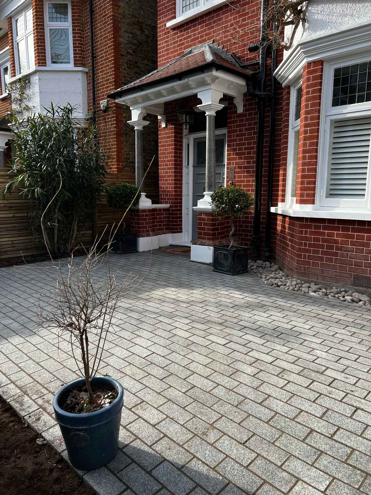 A driveway made from granite setts for this redbrick property in Putney.