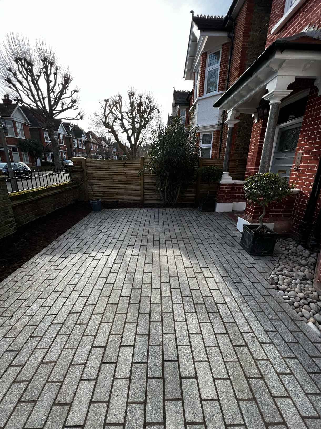 A driveway made from granite setts for this redbrick property in Putney.