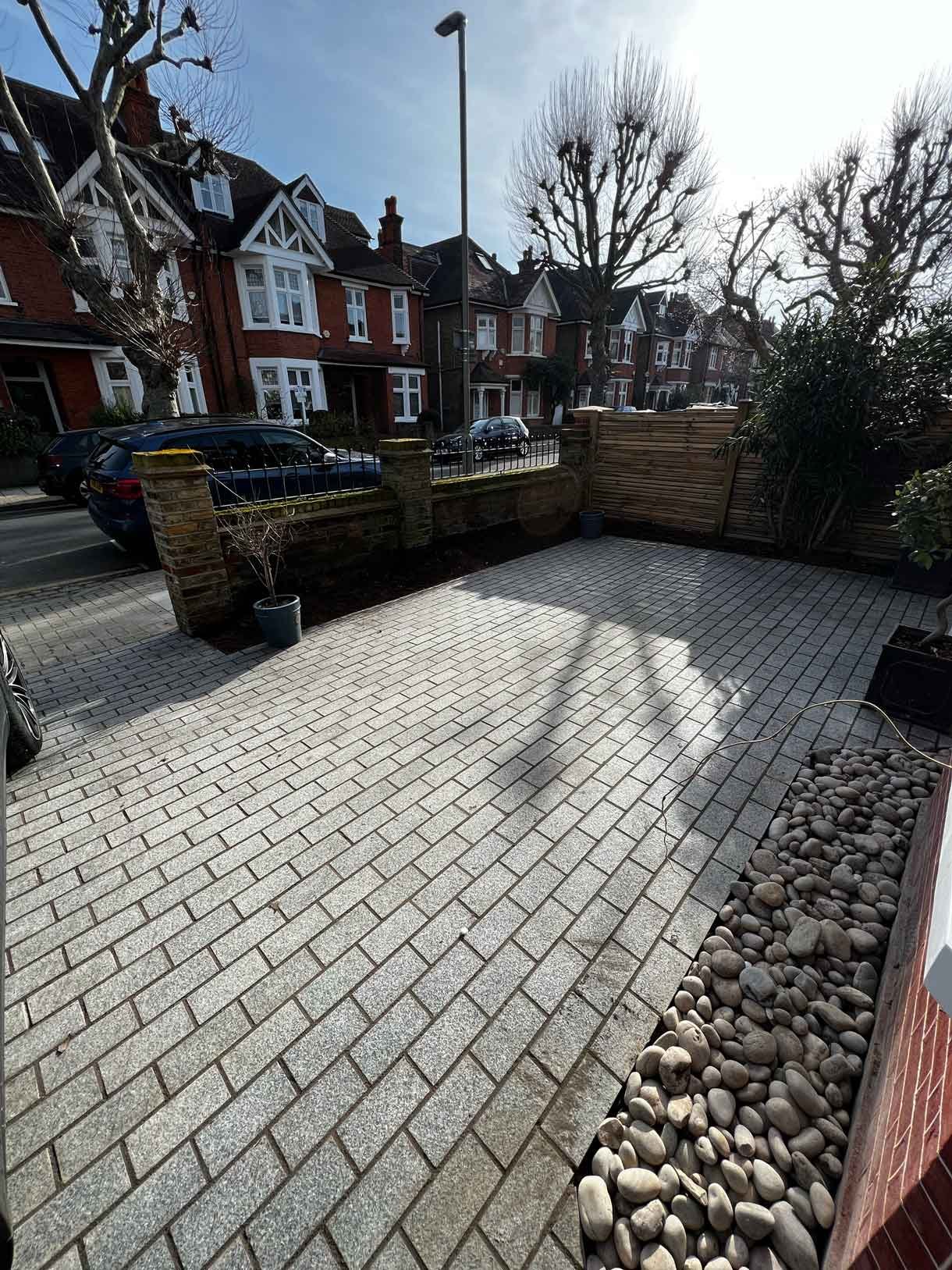 A driveway made from granite setts for this redbrick property in Putney.