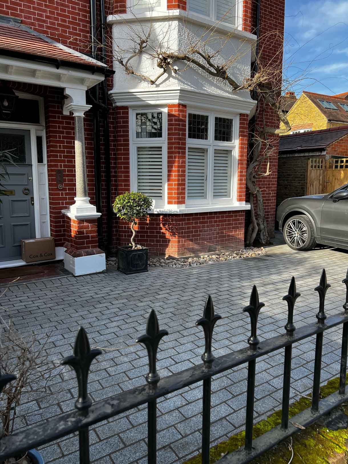 A driveway made from granite setts for this redbrick property in Putney.