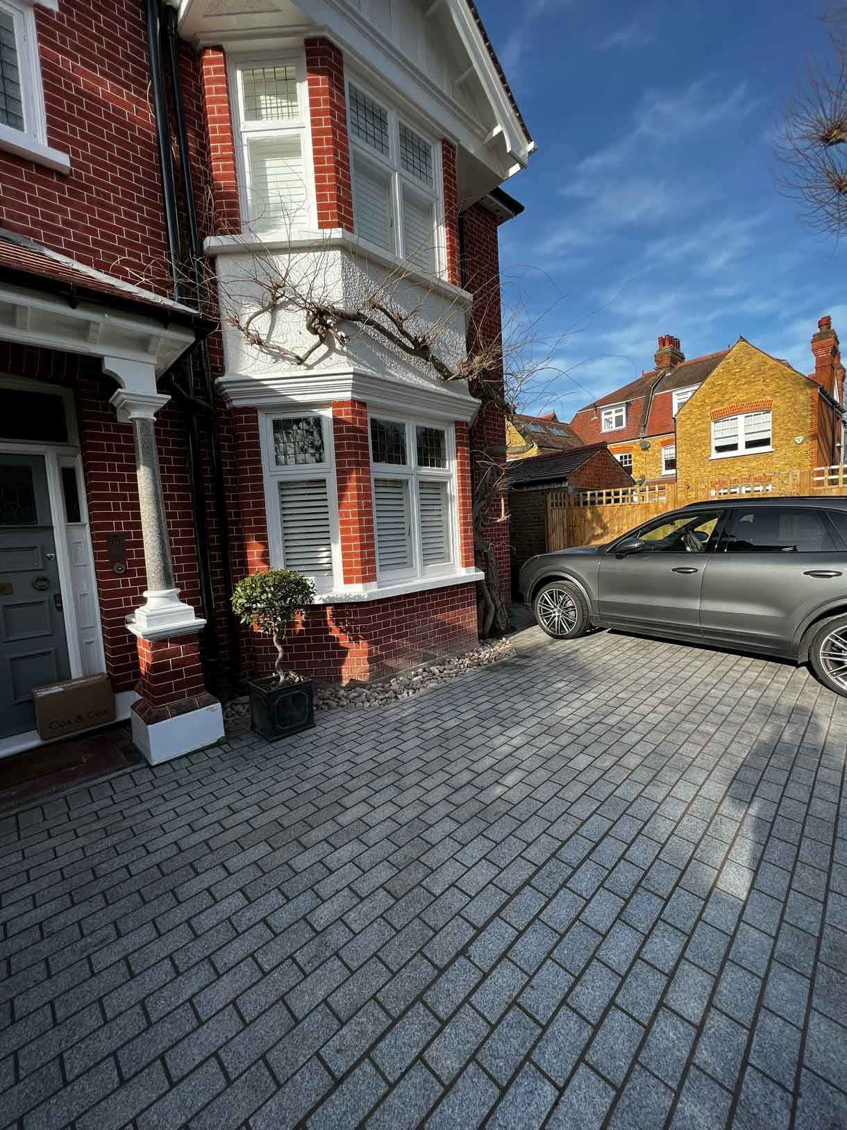A driveway made from granite setts for this redbrick property in Putney.