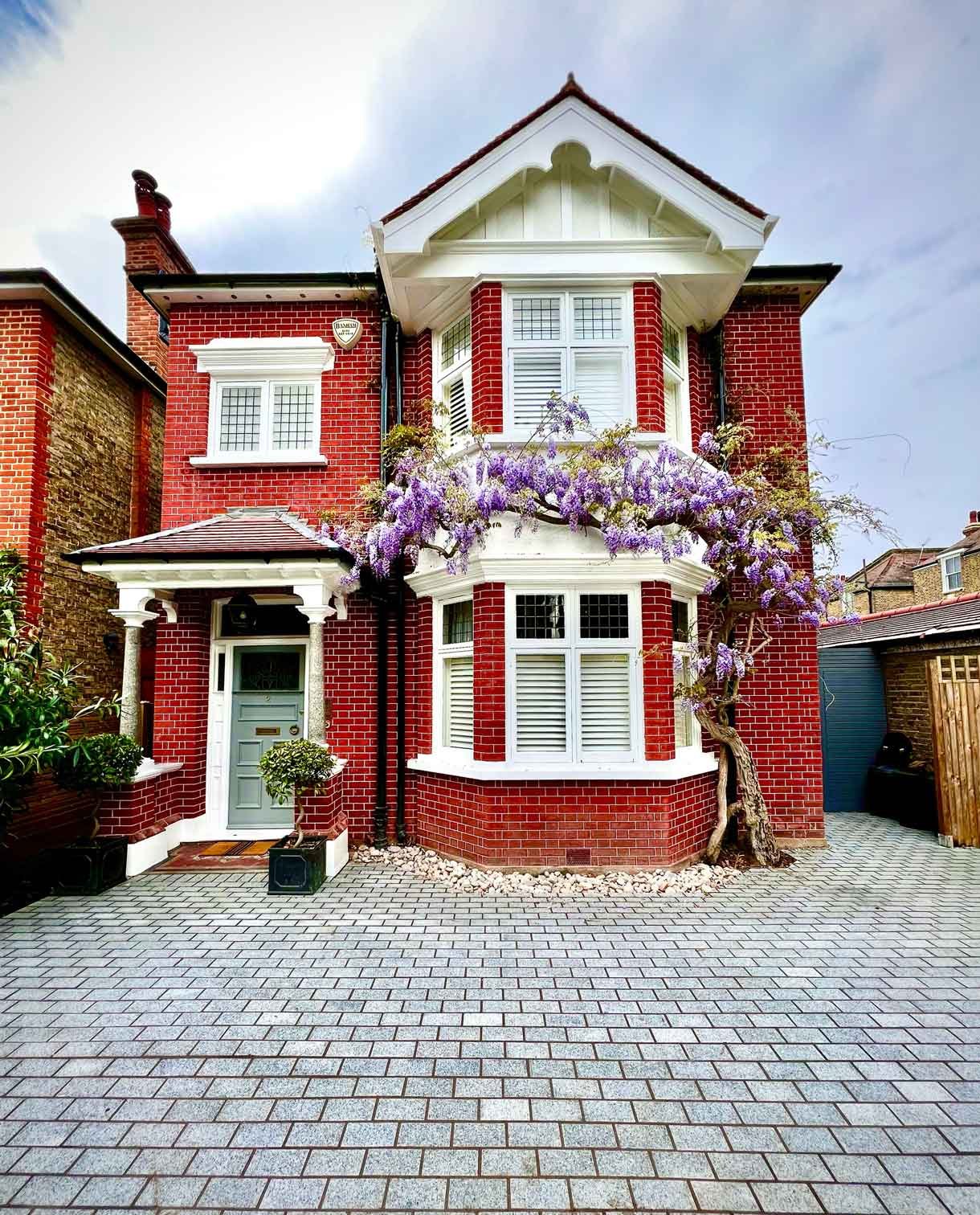 A driveway made from granite setts for this redbrick property in Putney.
