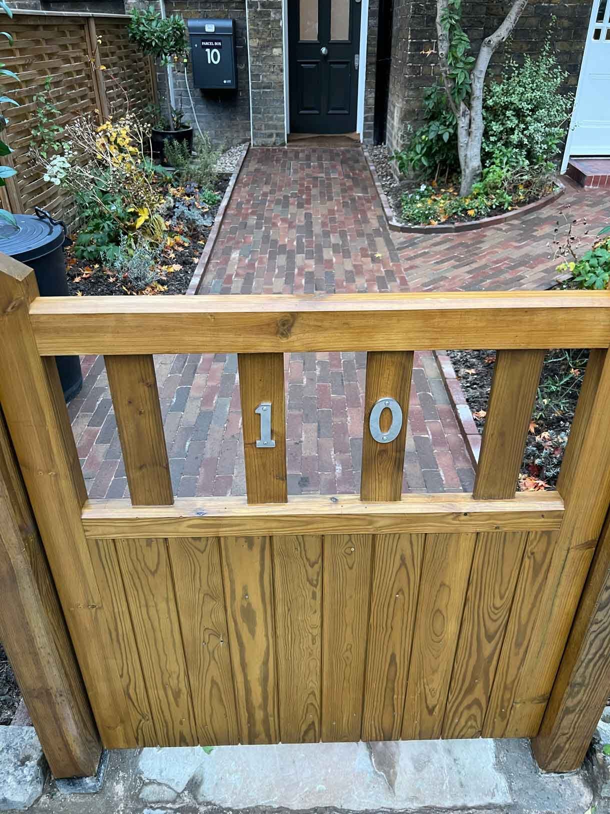 A clay paver path for the front of a listed house in Hammersmith, using warm red tones for the clay pavers.