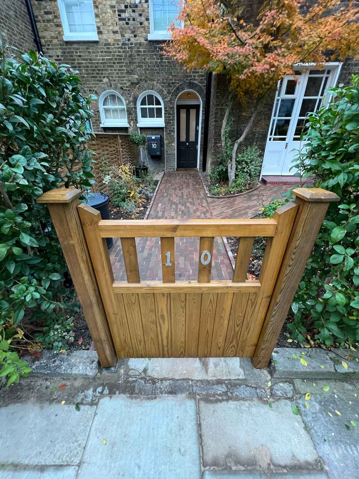 A clay paver path for the front of a listed house in Hammersmith, using warm red tones for the clay pavers.