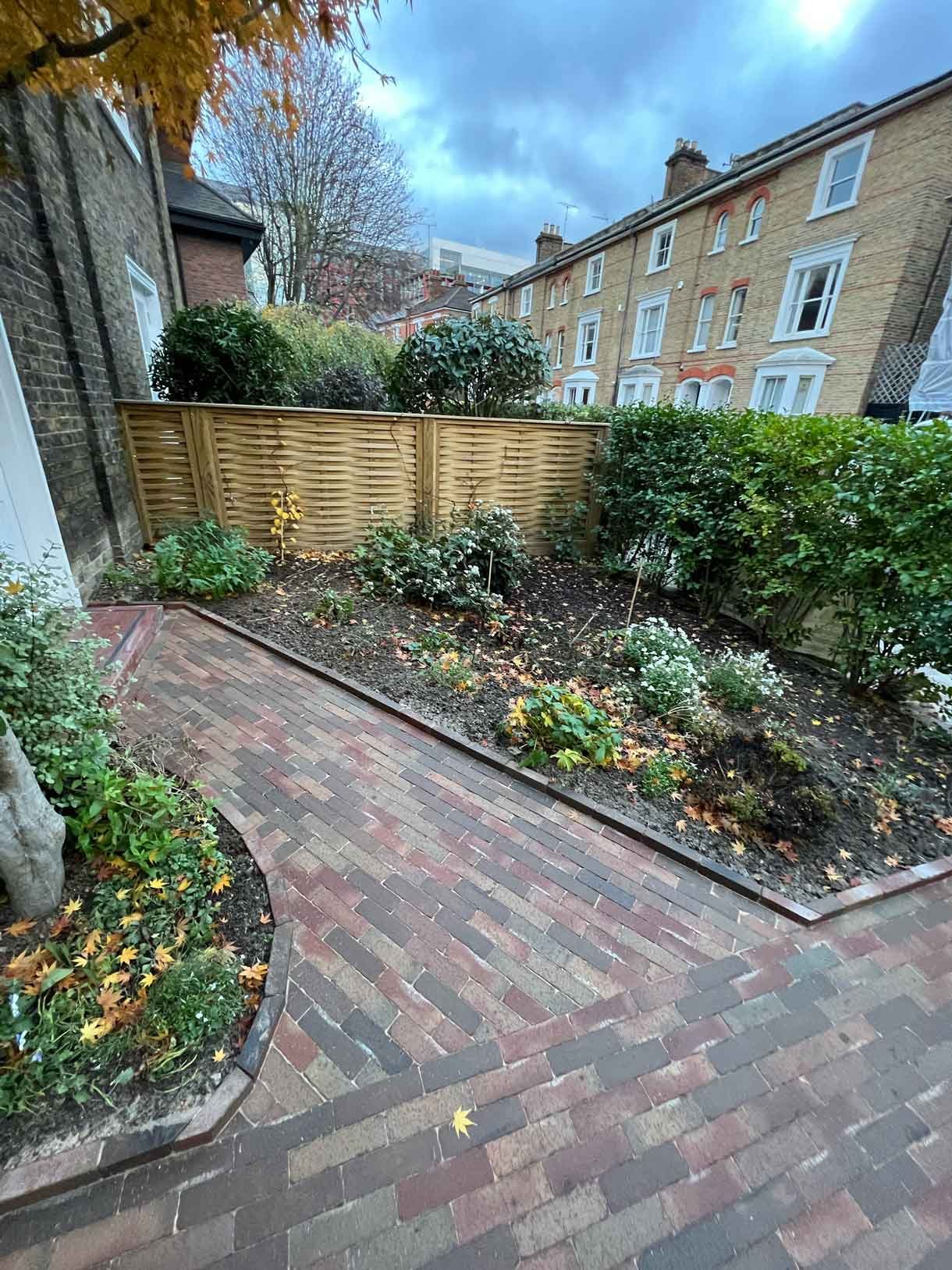 A clay paver path for the front of a listed house in Hammersmith, using warm red tones for the clay pavers.