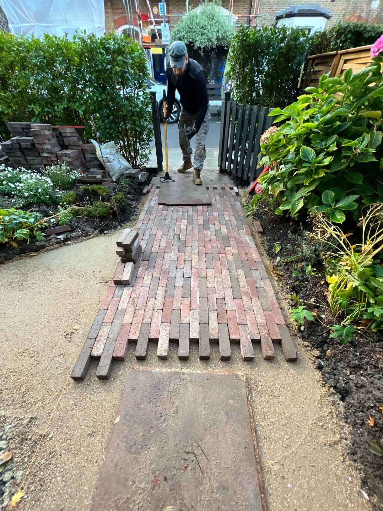 A clay paver path for the front of a listed house in Hammersmith, using warm red tones for the clay pavers.