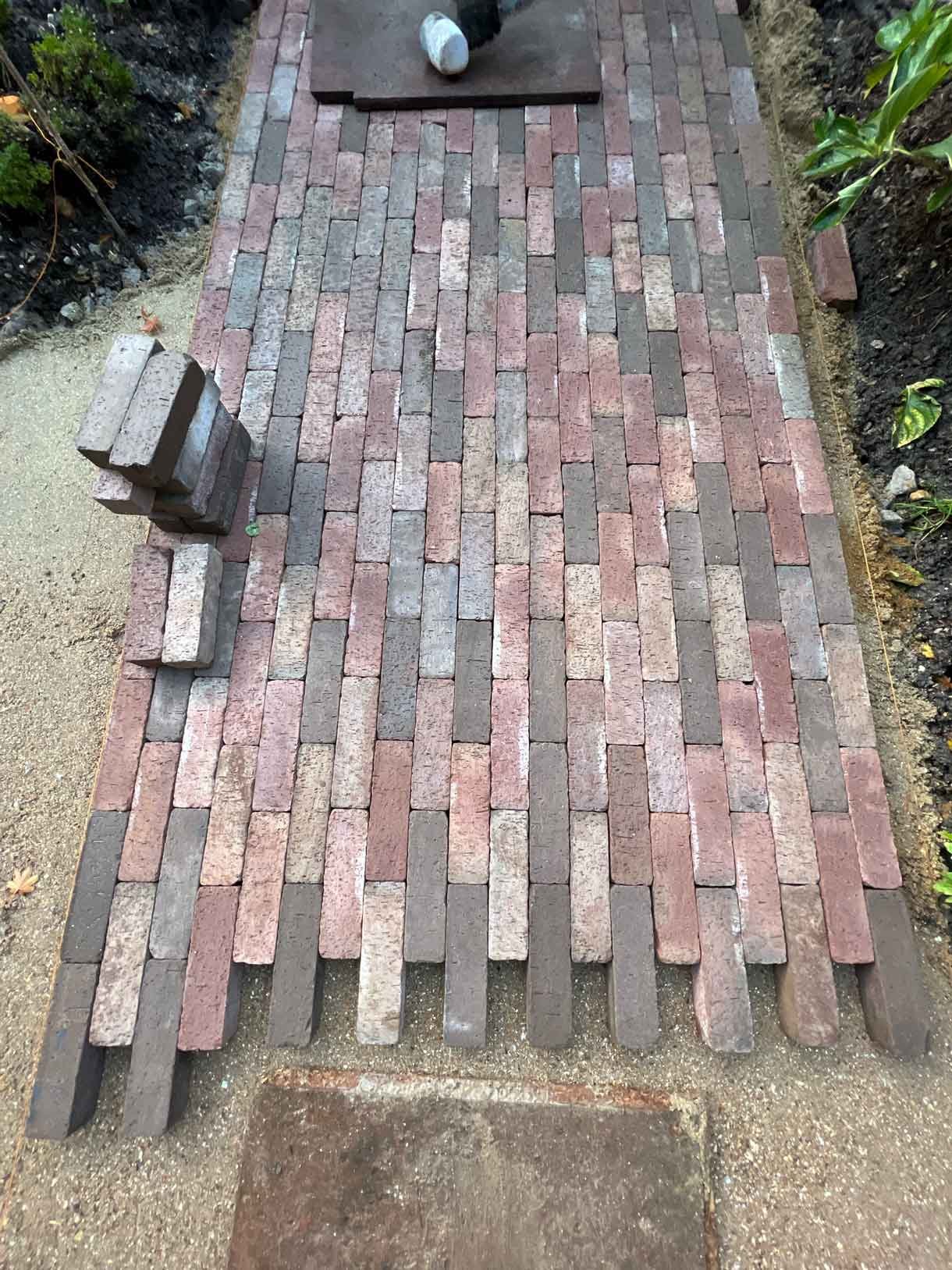 A clay paver path for the front of a listed house in Hammersmith, using warm red tones for the clay pavers.