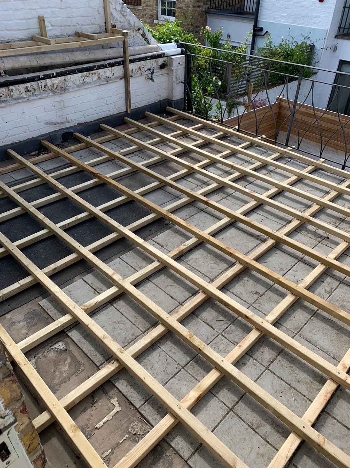 The roof terrace with wooden battens. Getting prepared for the composite deck.