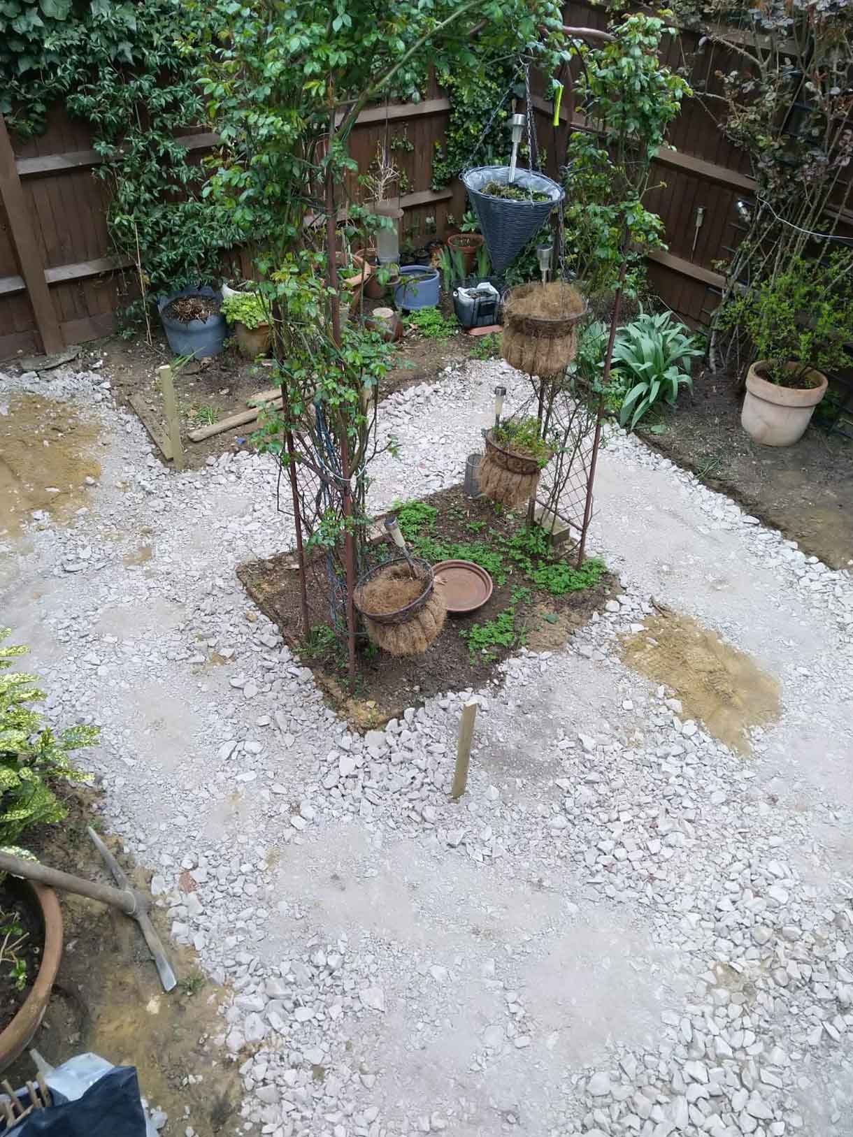 The courtyard garden before the transformation with old concrete tiles.