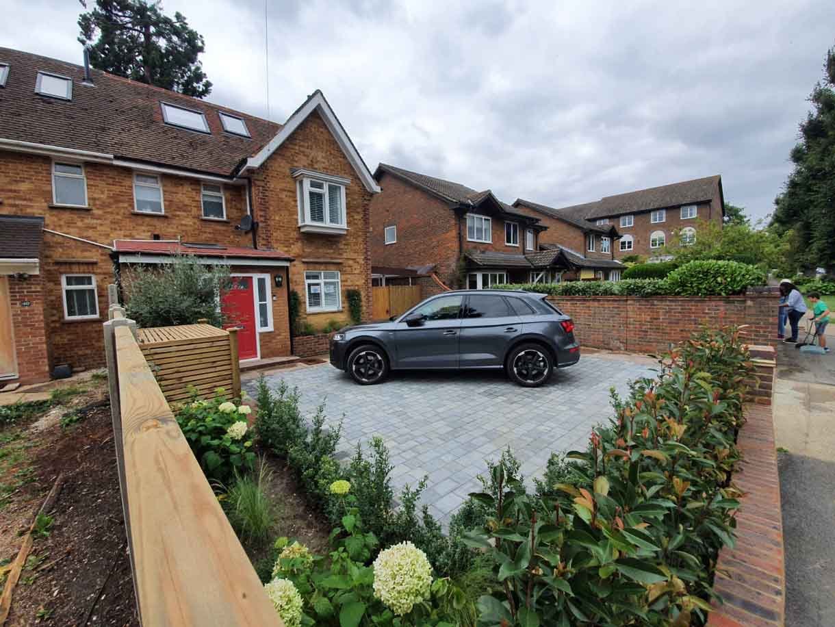 A new driveway with planting and bin storage in Surbiton.