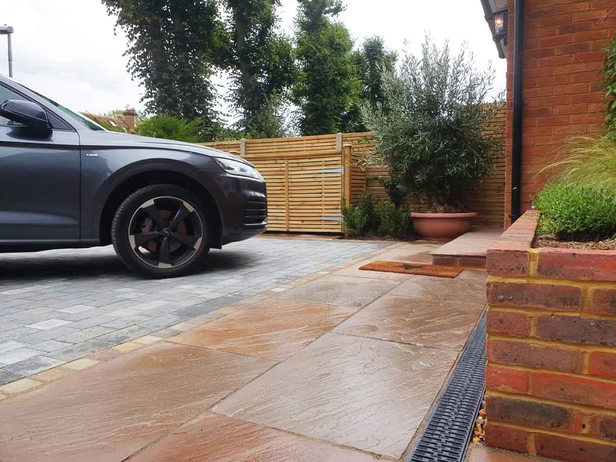 A new driveway with planting and bin storage in Surbiton.