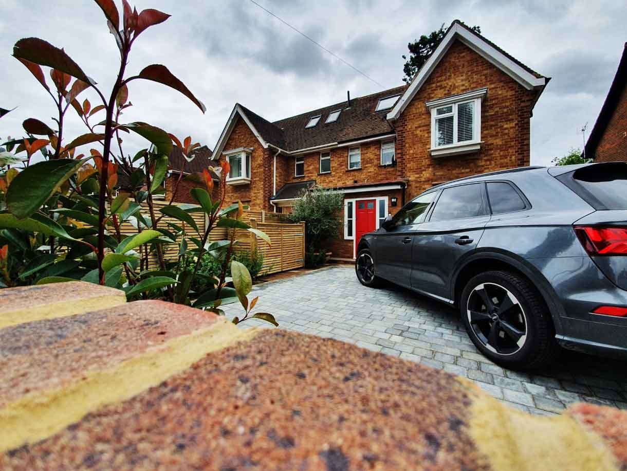 A new driveway with planting and bin storage in Surbiton.