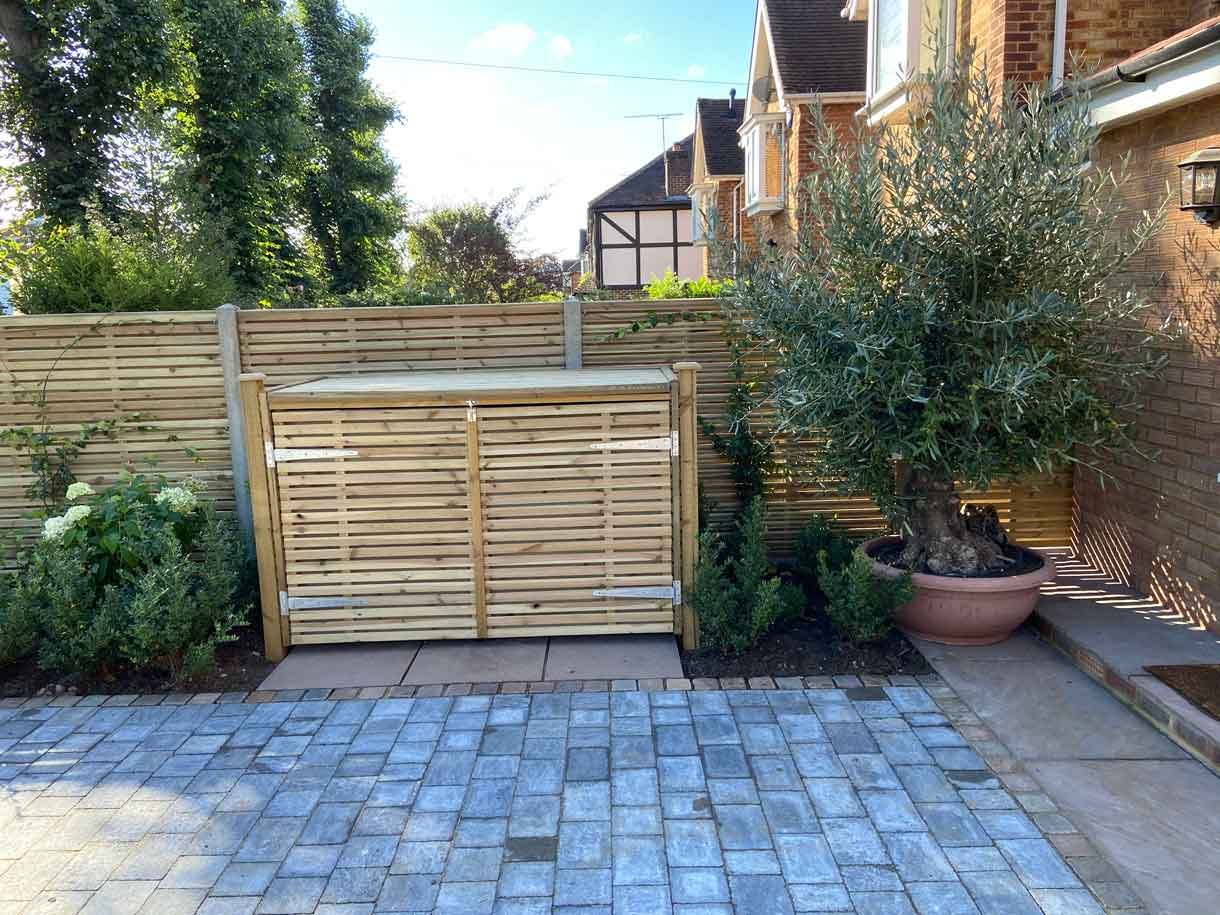 A new driveway with planting and bin storage in Surbiton.