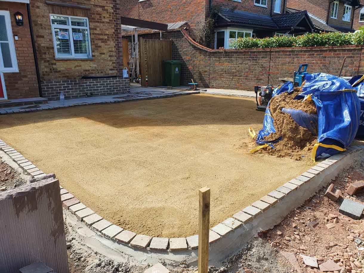 A new driveway with planting and bin storage in Surbiton.
