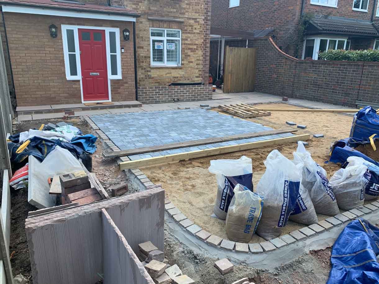 A new driveway with planting and bin storage in Surbiton.