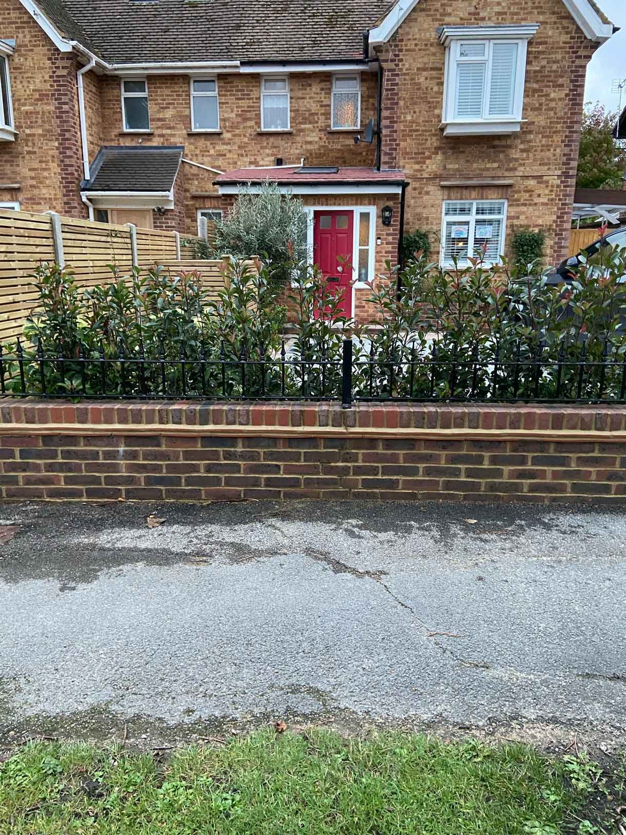 A new driveway with planting and bin storage in Surbiton.
