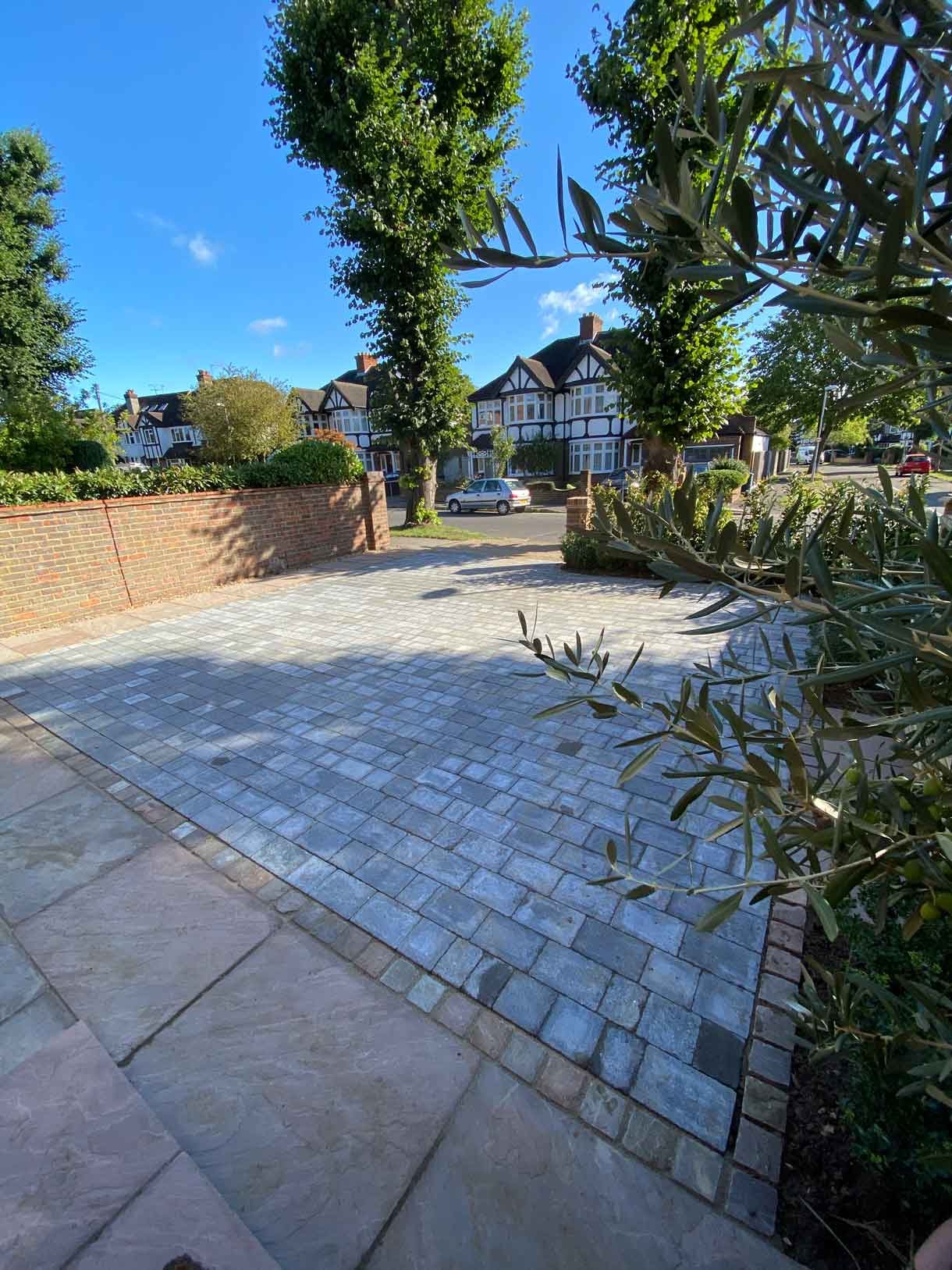 A new driveway with planting and bin storage in Surbiton.