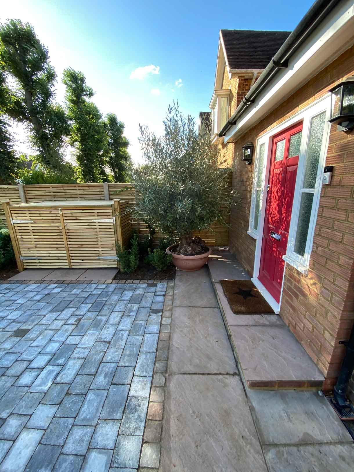 A new driveway with planting and bin storage in Surbiton.