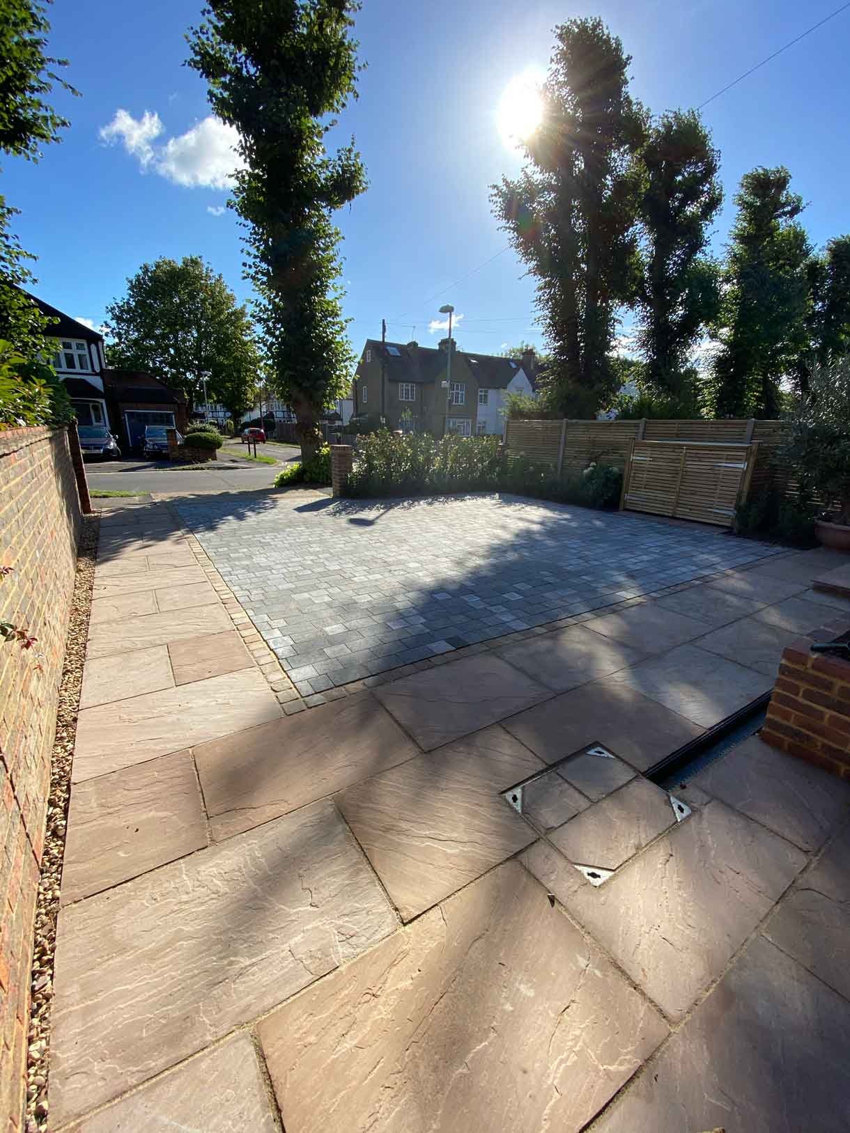 A new driveway with planting and bin storage in Surbiton.