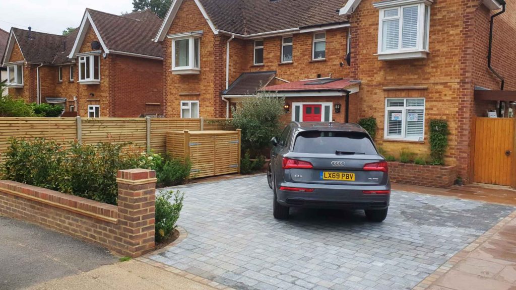 Modern semi-detached house with block paving driveway, planted borders and hardwood screening