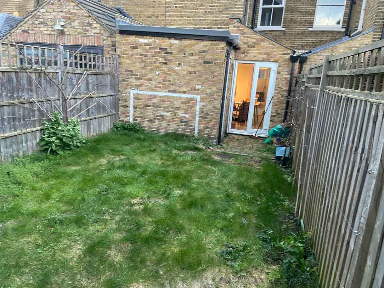 The garden before we started with just grass and a shed.