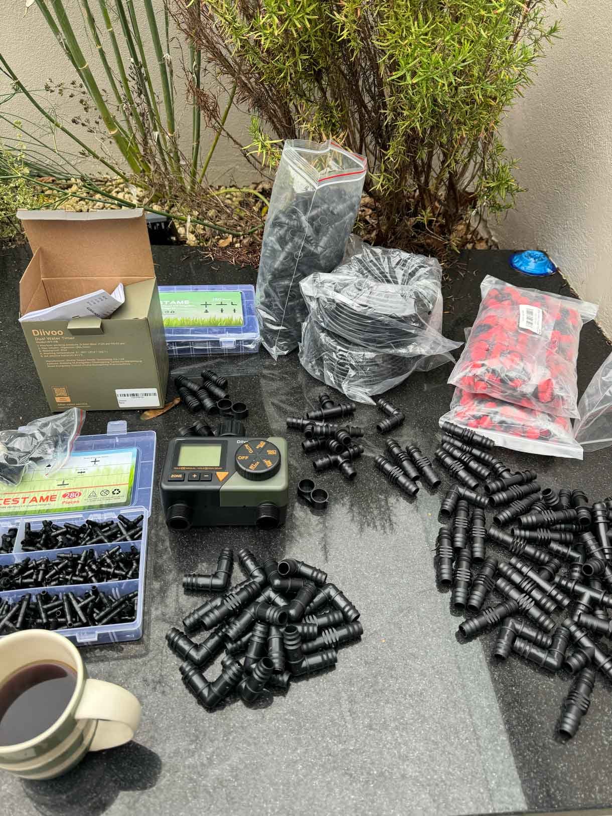 garden irrigation parts including piping and timer
