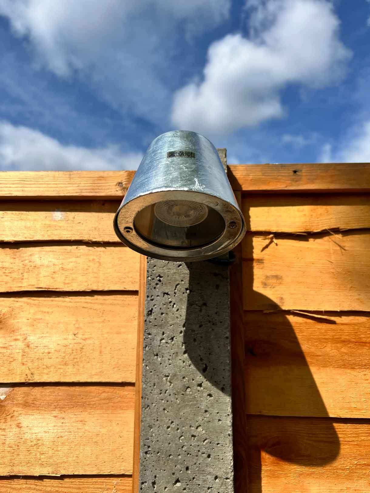 A light detail attached to a concrete fence post