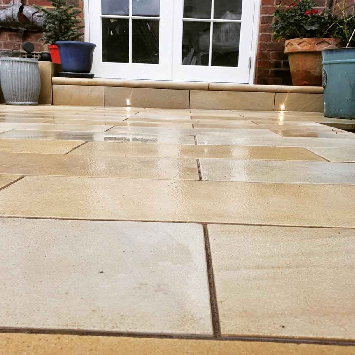 A small courtyard garden in Chiswick with raised planters.