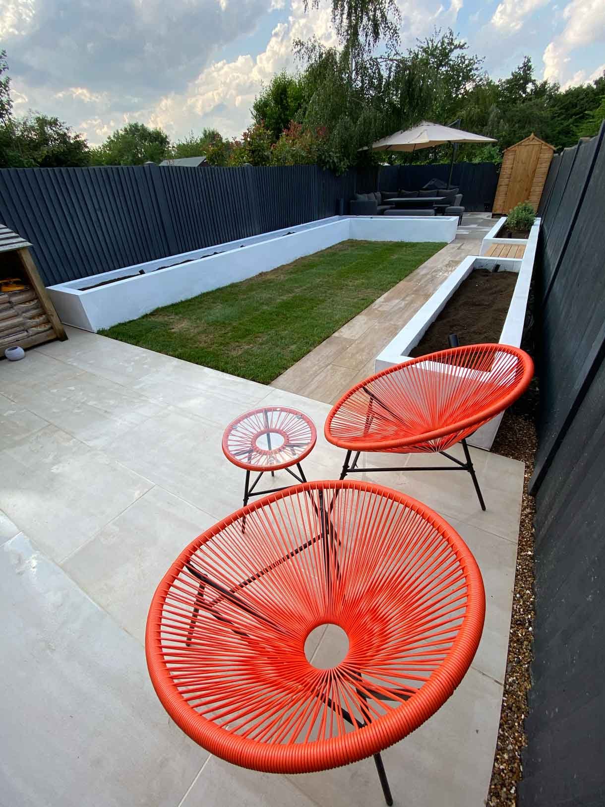This Tooting garden, previously neglected for decades as a rental property, was transformed into a vibrant and functional outdoor space tailored to the new owners' vision. With a sunny aspect throughout the day, the garden had long been underutilized, but we set out to change that by creating a design that aligned perfectly with the clients' lifestyle and love for outdoor entertaining. We introduced distinct seating areas, raised planters to add structure and greenery, and installed lighting to ensure the garden could be enjoyed from morning until late evening, delivering a welcoming atmosphere that invites relaxation and social gatherings.